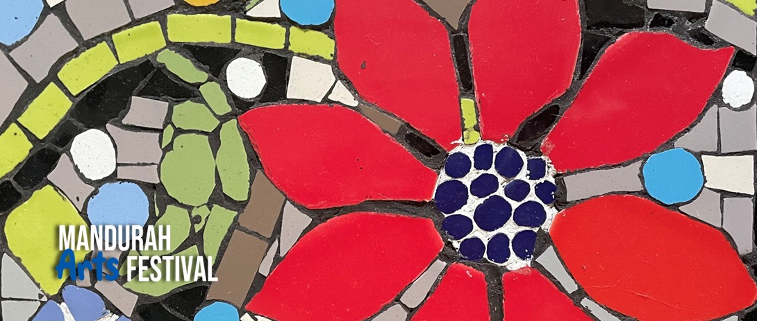a close image of a red flower made out of mosaic tiles